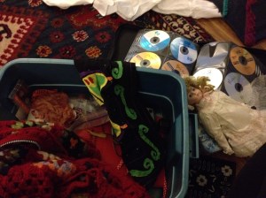 My granny square crochet sweater, porcelain doll, and sigur ros mixed cd.