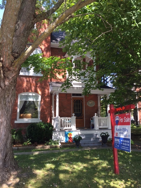 House with sold sign