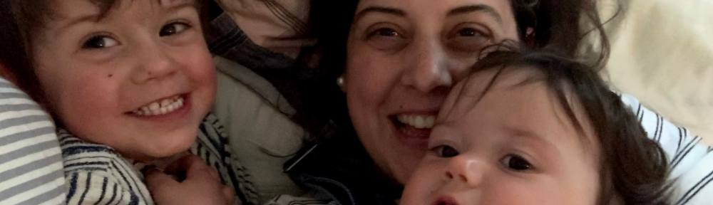 Me and my kids in a pile of laundry.